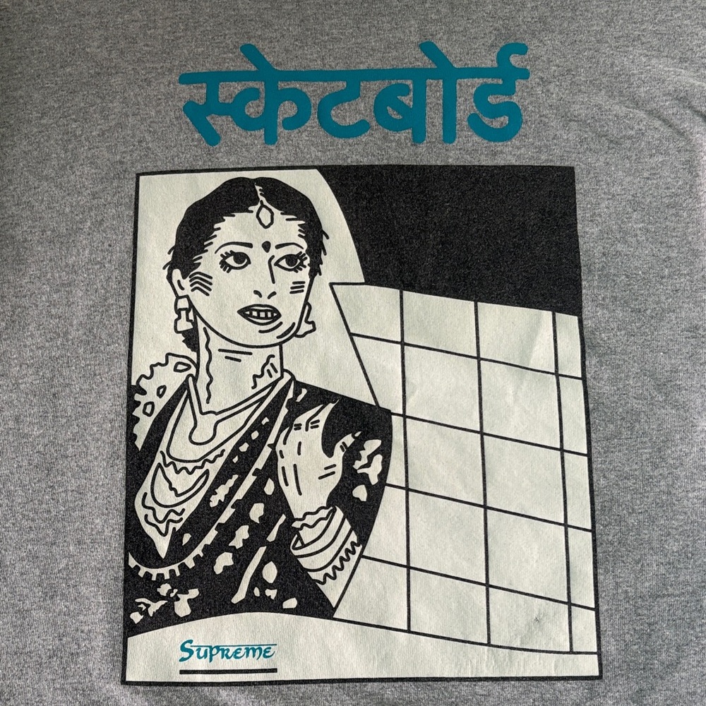 Supreme Grey Tee with Teal Hindi Script and Black Graphic